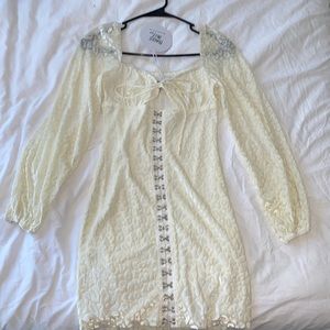 soft white/cream velvety leopard print dress with cute buttons in the middle